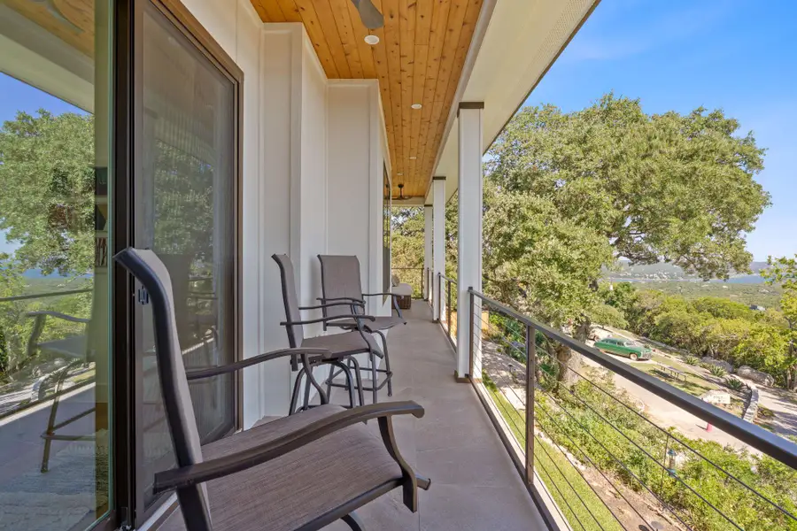Covered patio living with wide-open Hill Country and Lake Travis views, your new favorite place to unwind. Covered patio living with wide-open Hill Country and Lake Travis views, your new favorite place to unwind.
