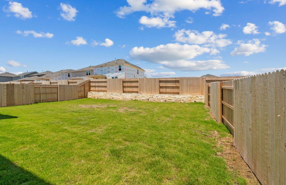 Front exterior of a new home in Patterson Ranch, Georgetown, TX, highlighting curb appeal (Image 20). Front exterior of a new home in Patterson Ranch, Georgetown, TX, highlighting curb appeal (Image 20).