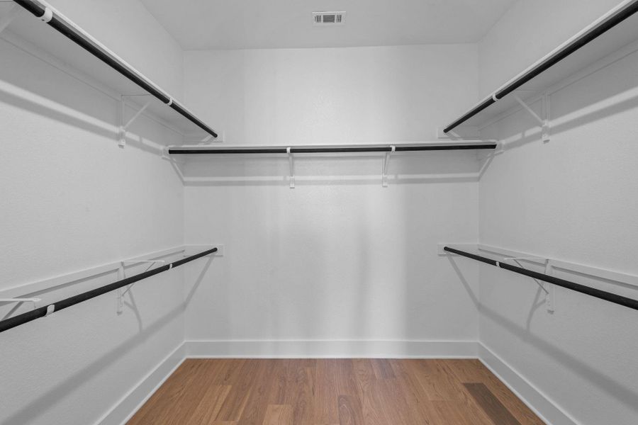 Walk-in closet in Primary Bedroom Walk-in closet in Primary Bedroom