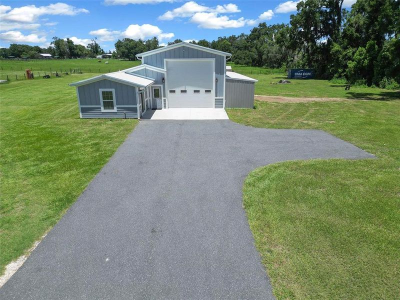 Front exterior of a new home in , Citra, FL, highlighting curb appeal (Image 18).