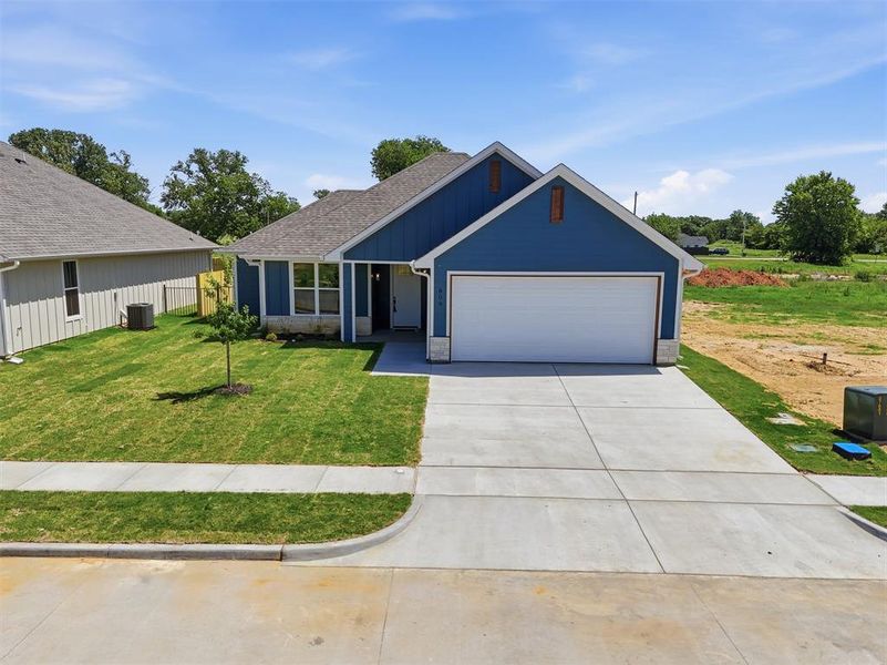 Front exterior of a new home in , Tolar, TX, highlighting curb appeal (Image 25).