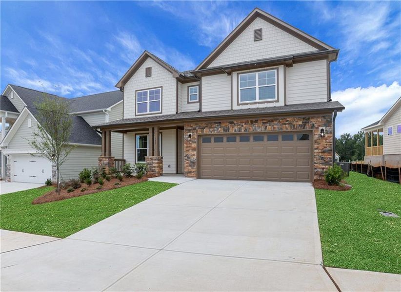 Front exterior of a new home in Twin Lakes, Hoschton, GA, highlighting curb appeal (Image 24).