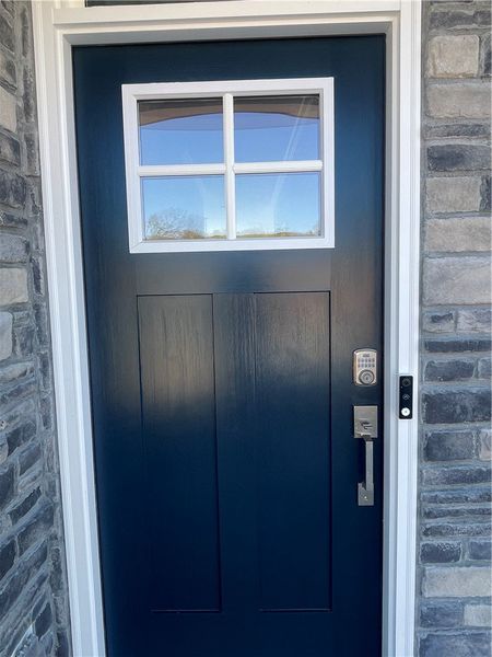 Exterior details and patio area of a home in Springwood Grove, Central (Image 3).