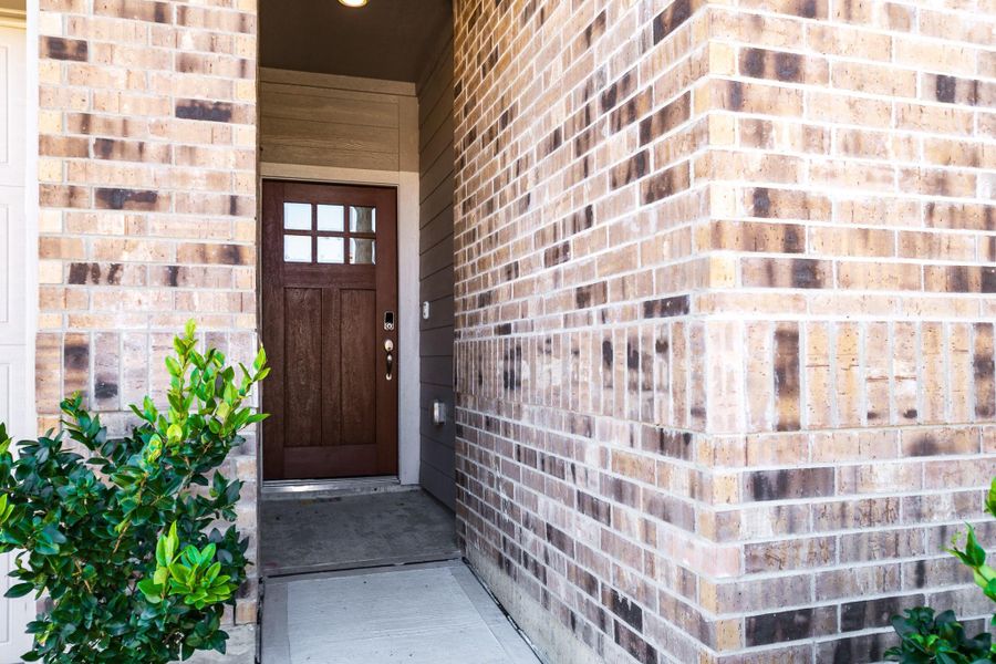 Exterior details and patio area of a home in Heights of Barbers Hill, Baytown (Image 3).