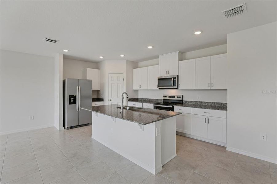 Furnished interior view inside a new home in Lawson Dunes - Signature Series, Haines City (Image 8). Furnished interior view inside a new home in Lawson Dunes - Signature Series, Haines City (Image 8).