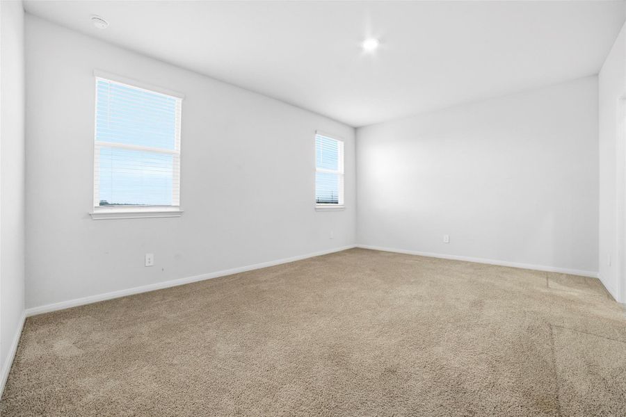 Unfurnished room with carpet floors and baseboards Unfurnished room with carpet floors and baseboards