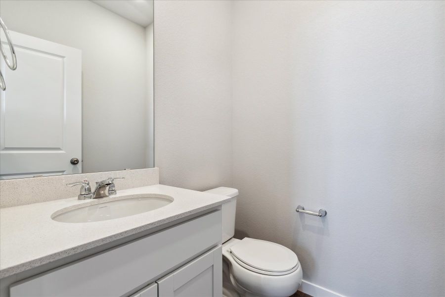 A bathroom with a sink and toilet.