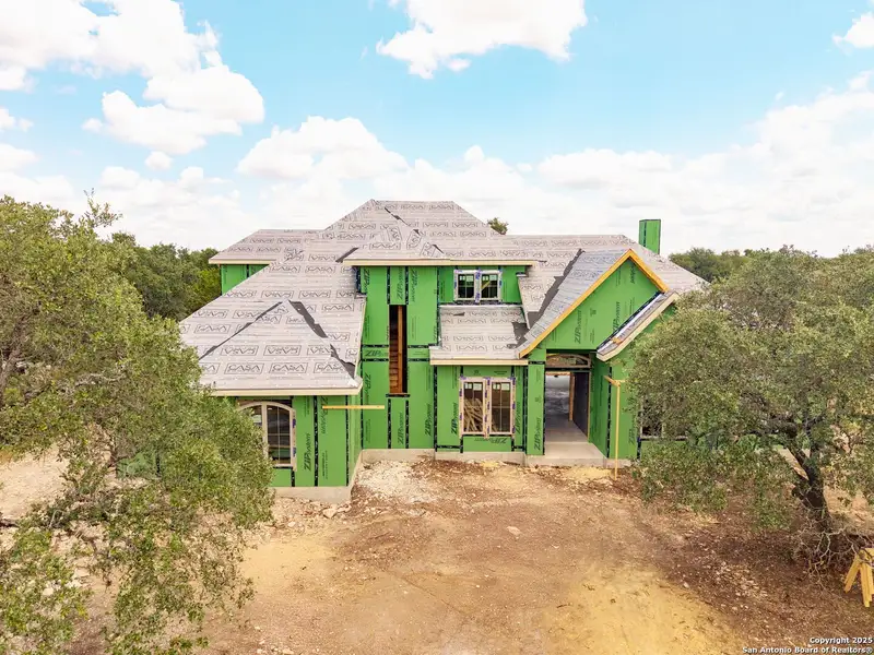 Front exterior of a new home in , Spring Branch, TX, highlighting curb appeal (Image 2).
