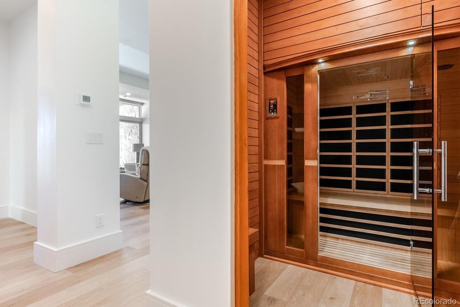 A dry sauna room completes the wellness-inspired design.