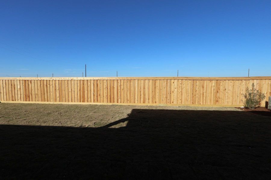 Exterior details and patio area of a home in Dunham Pointe, Cypress (Image 4).