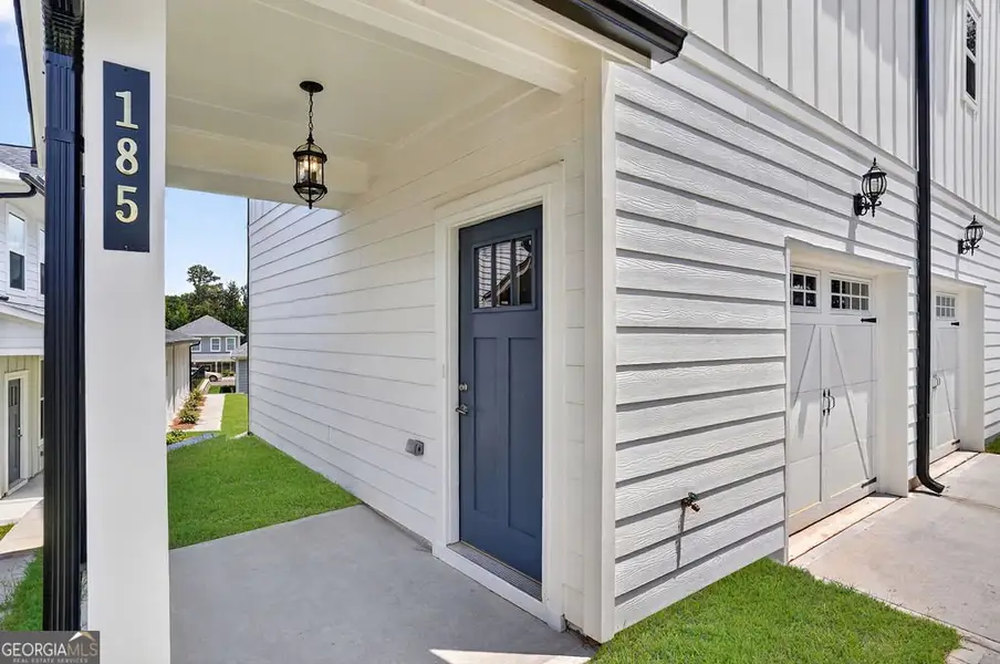 Exterior details and patio area of a home in The Cottages at East Lanier, Fayetteville (Image 3).