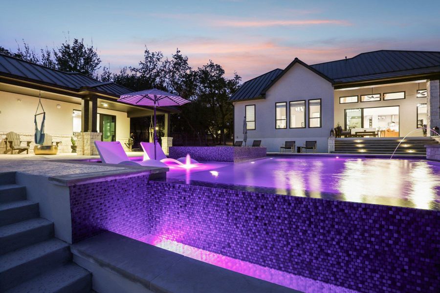 Private Resort: Situated on over one acre, this home offers a private resort experience with peekaboo lake views.