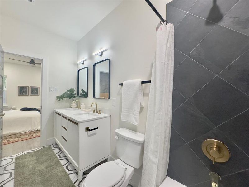 Bathroom with toilet, oversized vanity, and hardwood / wood-style floors