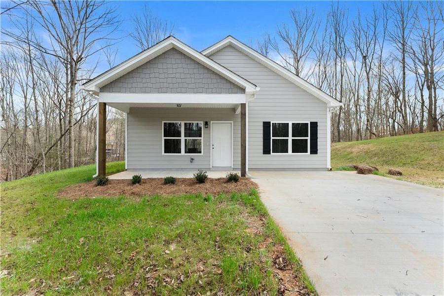 Front exterior of a new home in , Cleveland, GA, highlighting curb appeal (Image 21). Front exterior of a new home in , Cleveland, GA, highlighting curb appeal (Image 21).