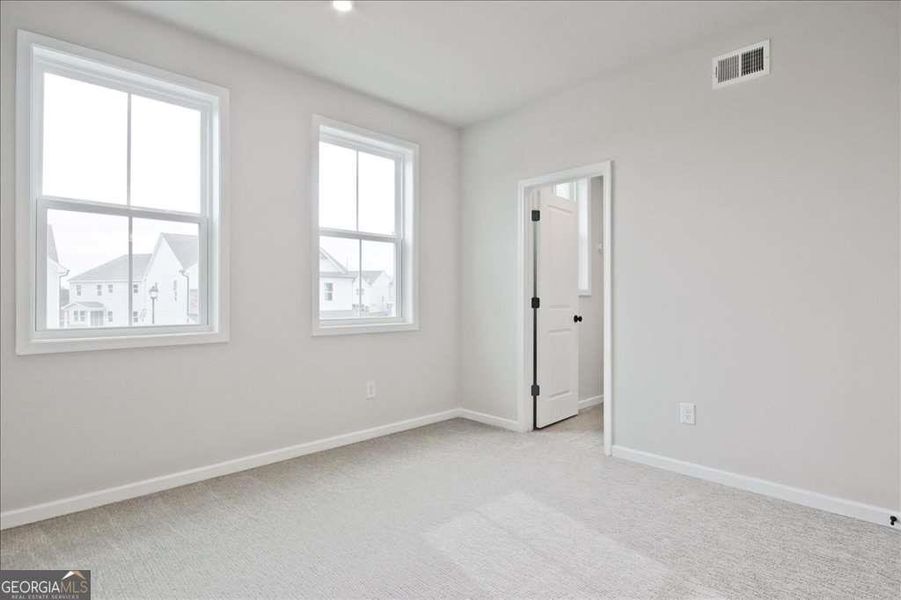 Spacious, unfurnished interior of a new home in The Paddocks at Doc Hughes, Buford (Image 33).