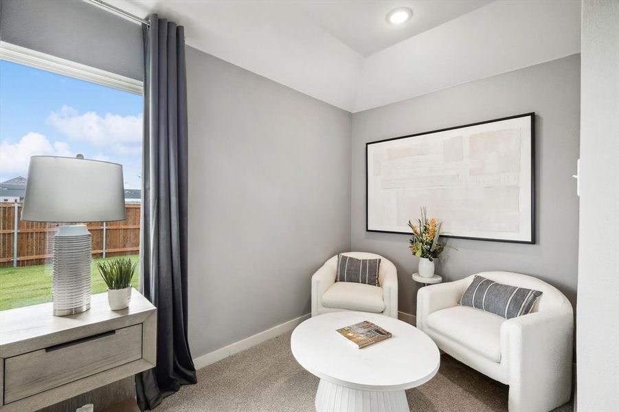 Sitting room with carpet and baseboards