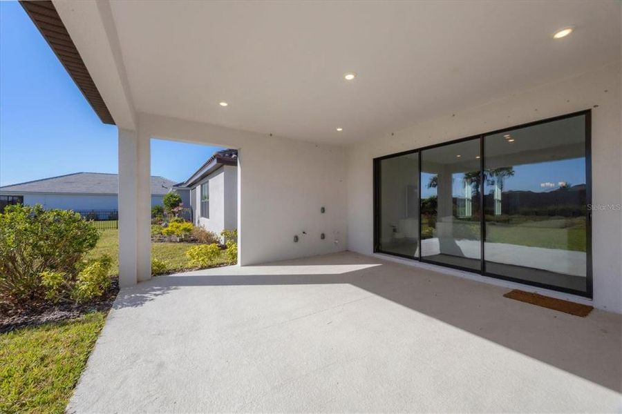 Exterior details and patio area of a home in Esplanade at Artisan Lakes, Palmetto (Image 3).