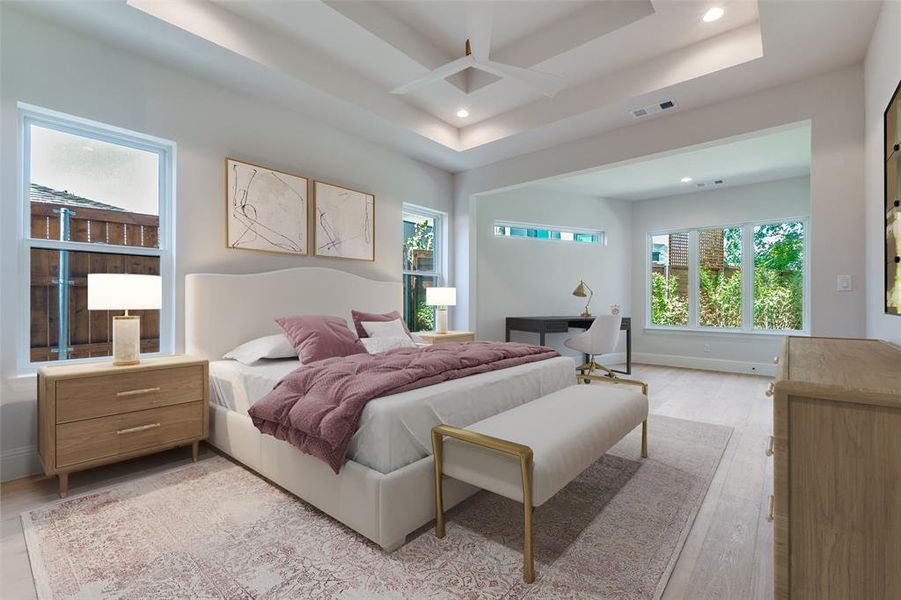 Bedroom featuring an office area, wood finished floors, a raised ceiling, and recessed lighting Bedroom featuring an office area, wood finished floors, a raised ceiling, and recessed lighting