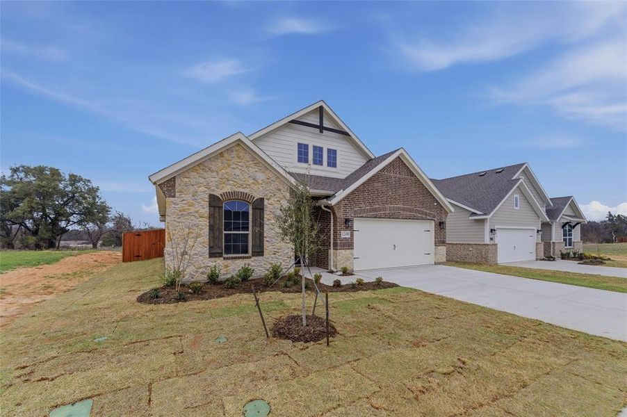 Front exterior of a new home in Covenant Park, Springtown, TX, highlighting curb appeal (Image 17).