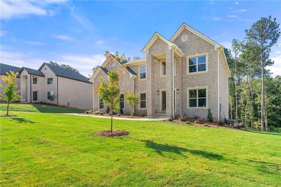 Front exterior of a new home in Underwood Crossing, Covington, GA, highlighting curb appeal (Image 16).