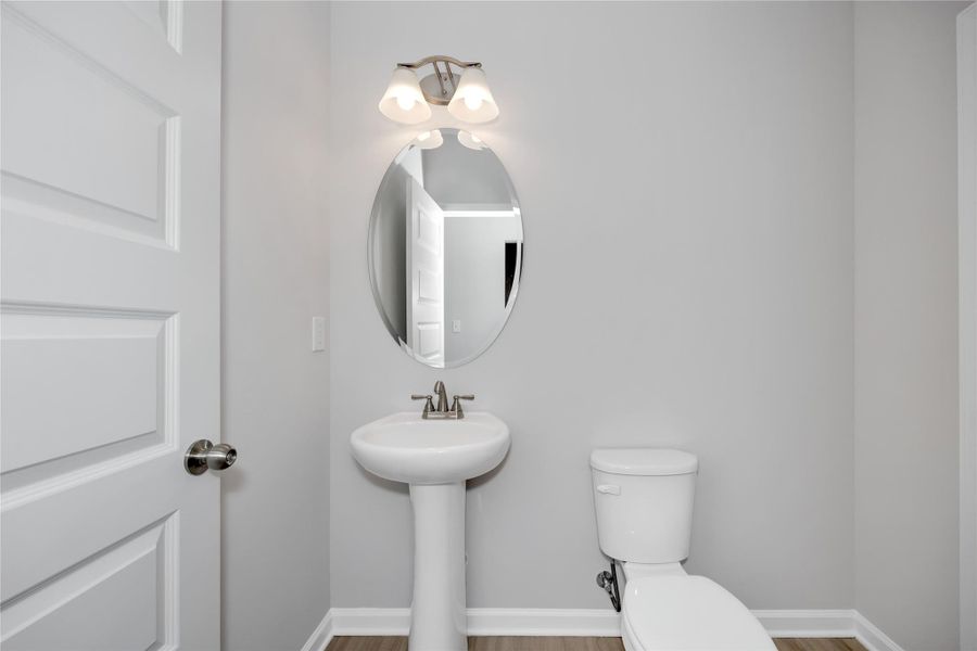 The Harrington- First floor powder bath. Sample image for illustration; upgrades, options, and colors may vary. The Harrington- First floor powder bath. Sample image for illustration; upgrades, options, and colors may vary.