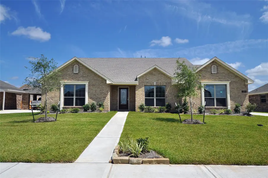 Front exterior of a new home in , League City, TX, highlighting curb appeal (Image 1). Front exterior of a new home in , League City, TX, highlighting curb appeal (Image 1).