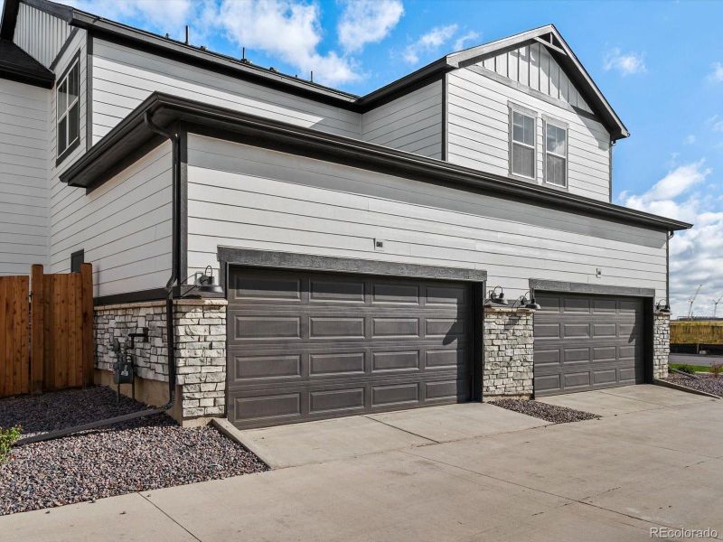 Front exterior of a new home in Horizon Uptown: The Mountain Collection, Aurora, CO, highlighting curb appeal (Image 22). Front exterior of a new home in Horizon Uptown: The Mountain Collection, Aurora, CO, highlighting curb appeal (Image 22).