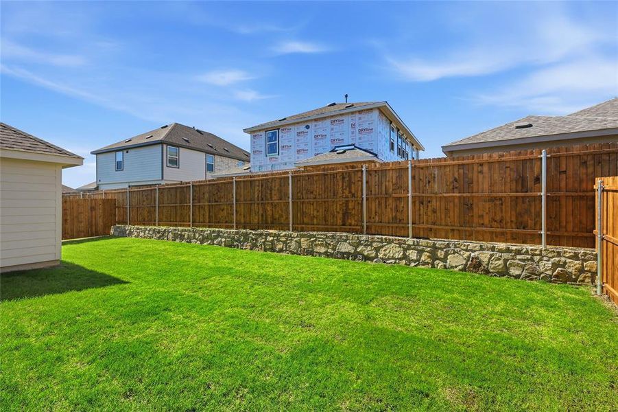 View of fenced backyard