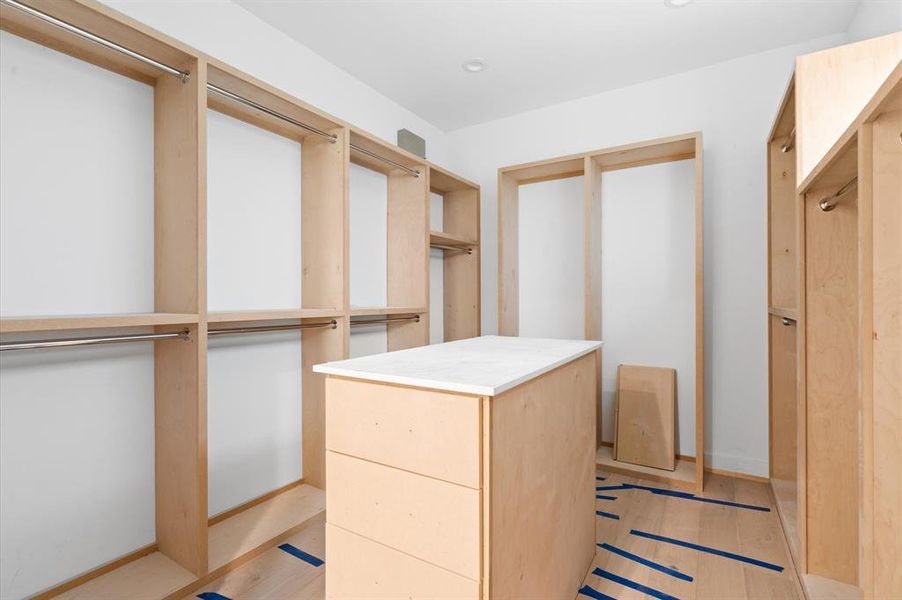 Spacious primary closet is designed for maximum organization.