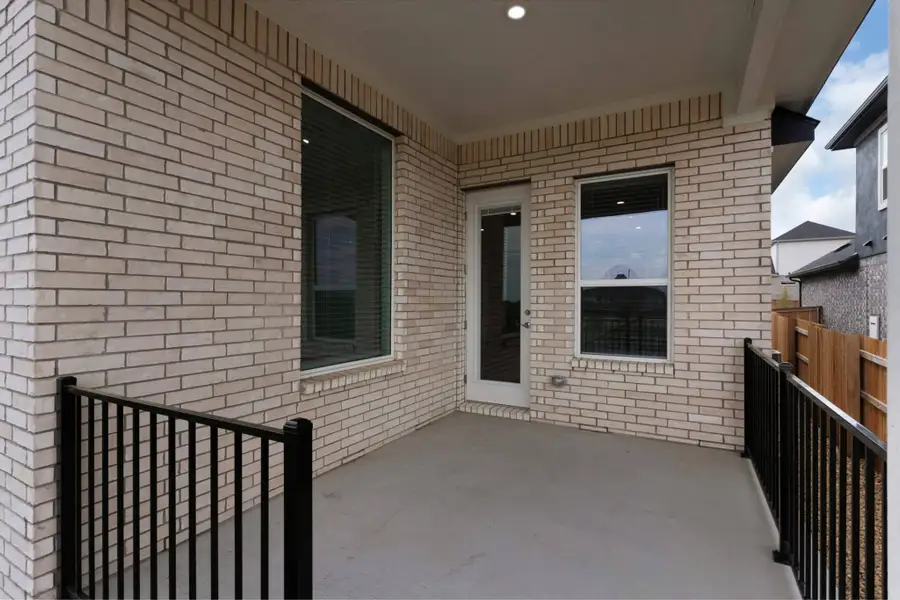 Exterior details and patio area of a home in University Heights, Round Rock (Image 3).