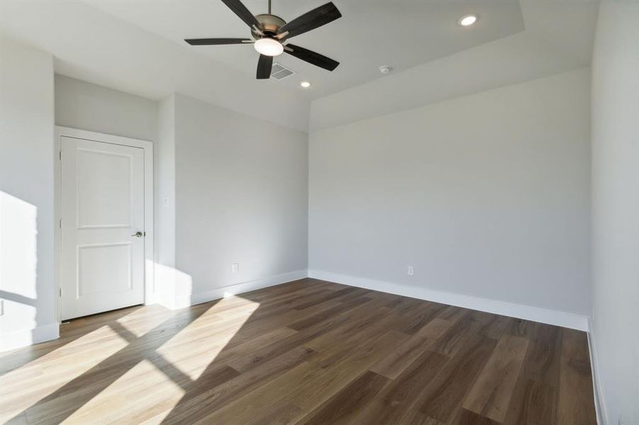 Unfurnished room featuring hardwood / wood-style floors and ceiling fan