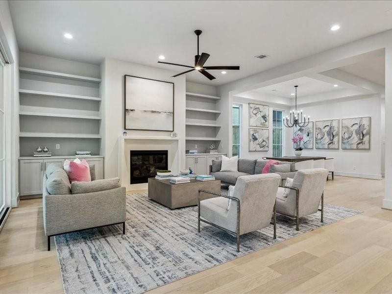 View of Living room with custom built in shelves