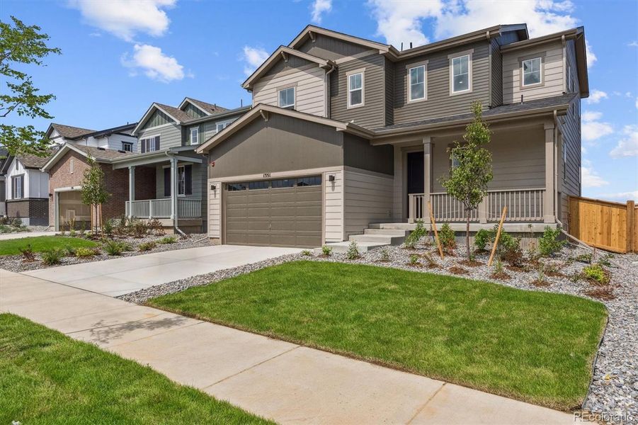 Front exterior of a new home in Floret Collection at Parkdale Commons, Lafayette, CO, highlighting curb appeal (Image 1).