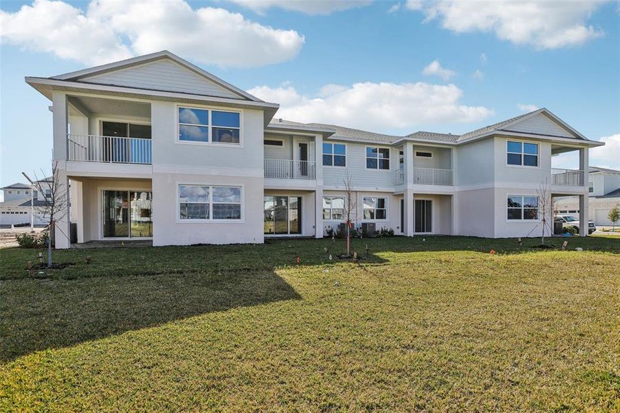 Exterior details and patio area of a home in Lagoon Residences at Epperson, Wesley Chapel (Image 23).