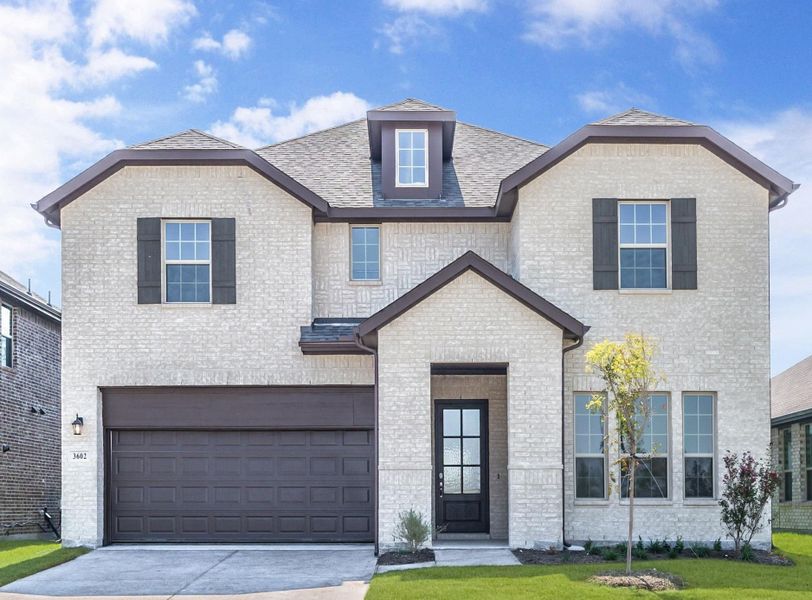 Representative exterior photo of a completed home built from the Trinity Executive by UnionMain Homes in Milrany Ranch, Melissa, TX (Image 1).