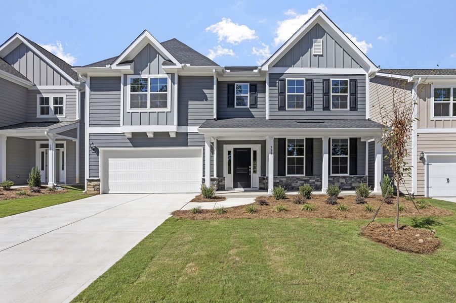 Front exterior of a new home in Georgias Landing, Raleigh, NC, highlighting curb appeal (Image 1).