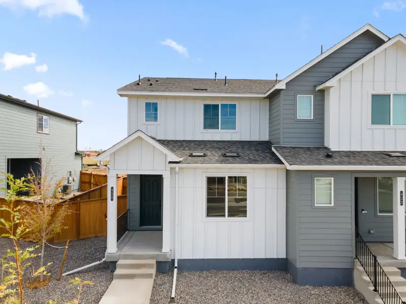 Front exterior of a new home in Sky Ranch, Watkins, CO, highlighting curb appeal (Image 20).