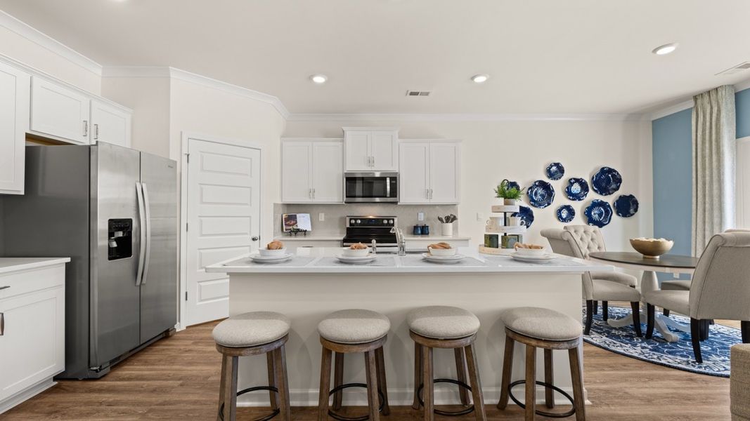 Representative furnished interior of a home built from the Hayden by D.R. Horton in Champion's Run, Lithonia (Image 5).