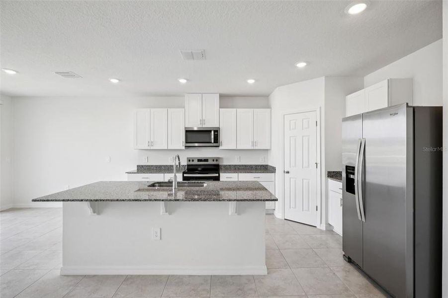 Furnished interior view inside a new home in Villamar - Signature Series, Winter Haven (Image 3).