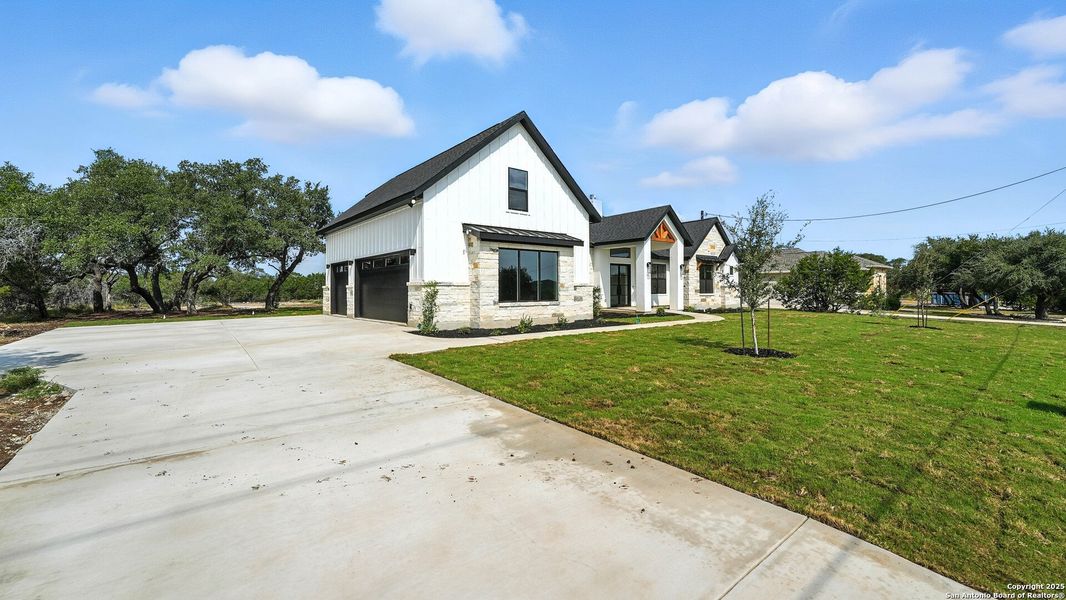 Front exterior of a new home in , Spring Branch, TX, highlighting curb appeal (Image 23).