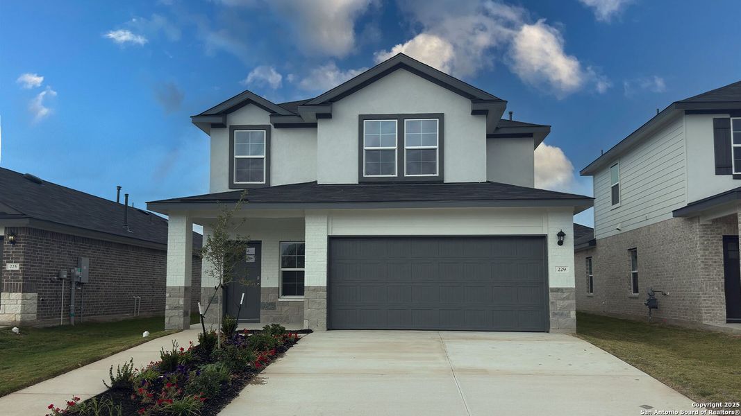 Front exterior of a new home in Whisper South, San Marcos, TX, highlighting curb appeal (Image 1).