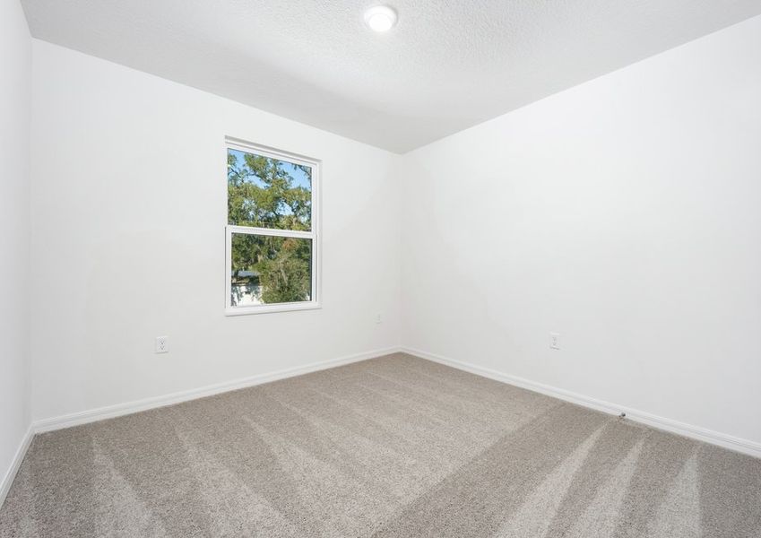 Lush carpet is featured in each bedroom