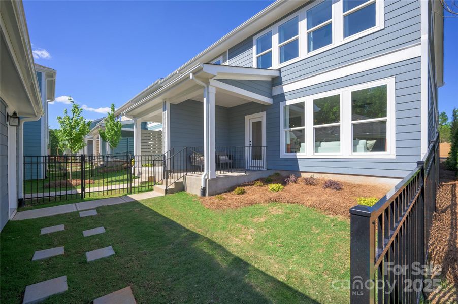 Exterior details and patio area of a home in North Creek Village, Huntersville (Image 3).