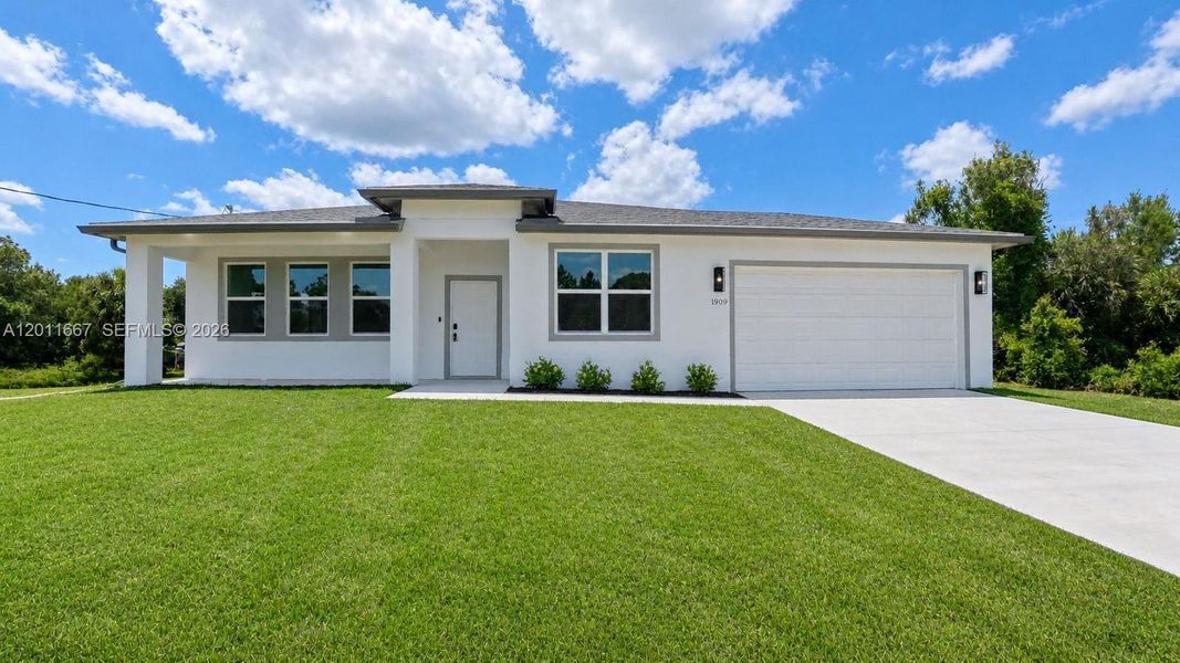 Front exterior of a new home in , Lehigh Acres, FL, highlighting curb appeal (Image 17). Front exterior of a new home in , Lehigh Acres, FL, highlighting curb appeal (Image 17).
