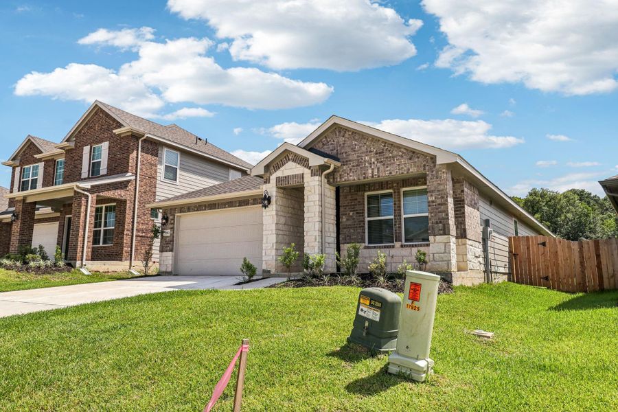 Front exterior of a new home in Pine Lake Cove - Premier Series, Montgomery, TX, highlighting curb appeal (Image 8).