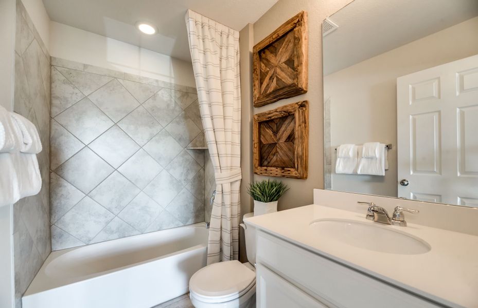 Secondary bathroom with tile-surround shower Secondary bathroom with tile-surround shower