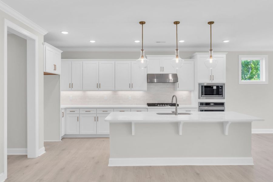 Representative furnished interior of a home built from the The Bradley by RobuckHomes in Windwater, Hampstead (Image 62).