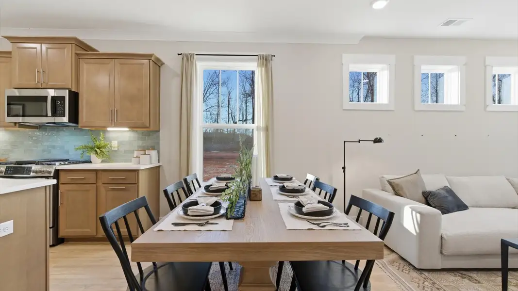Vibrant and spacious breakfast area in an exceptional townhome by DRB Homes located in Greenville, SC
