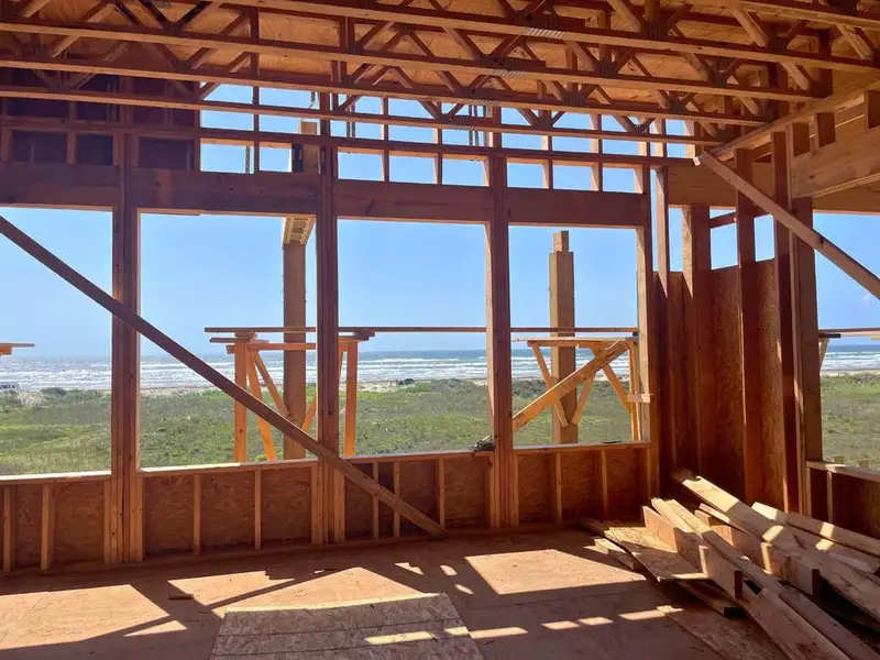 Future living room with dramatic vaulted ceilings and walls of glass facing the coast. Future living room with dramatic vaulted ceilings and walls of glass facing the coast.