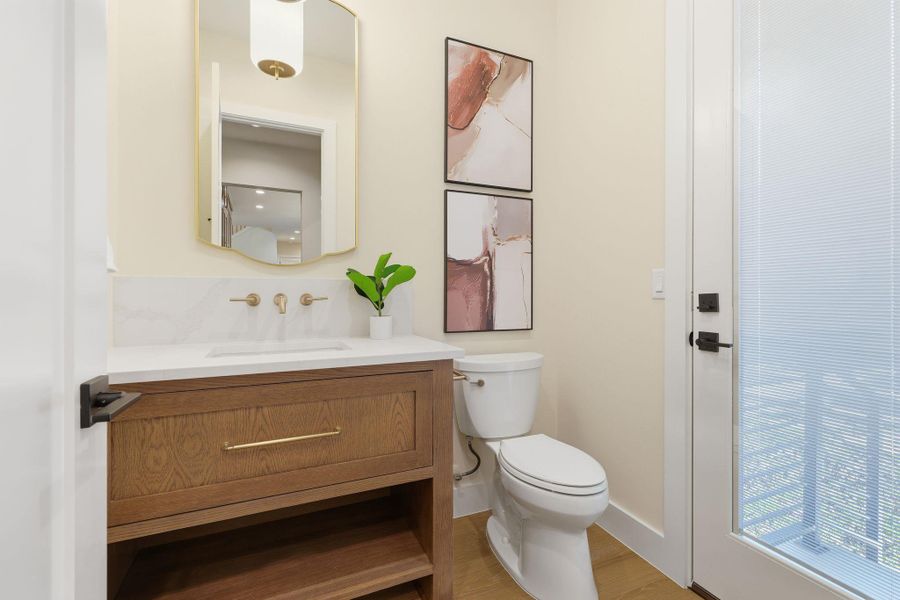 Bathroom featuring vanity and wood finished floors